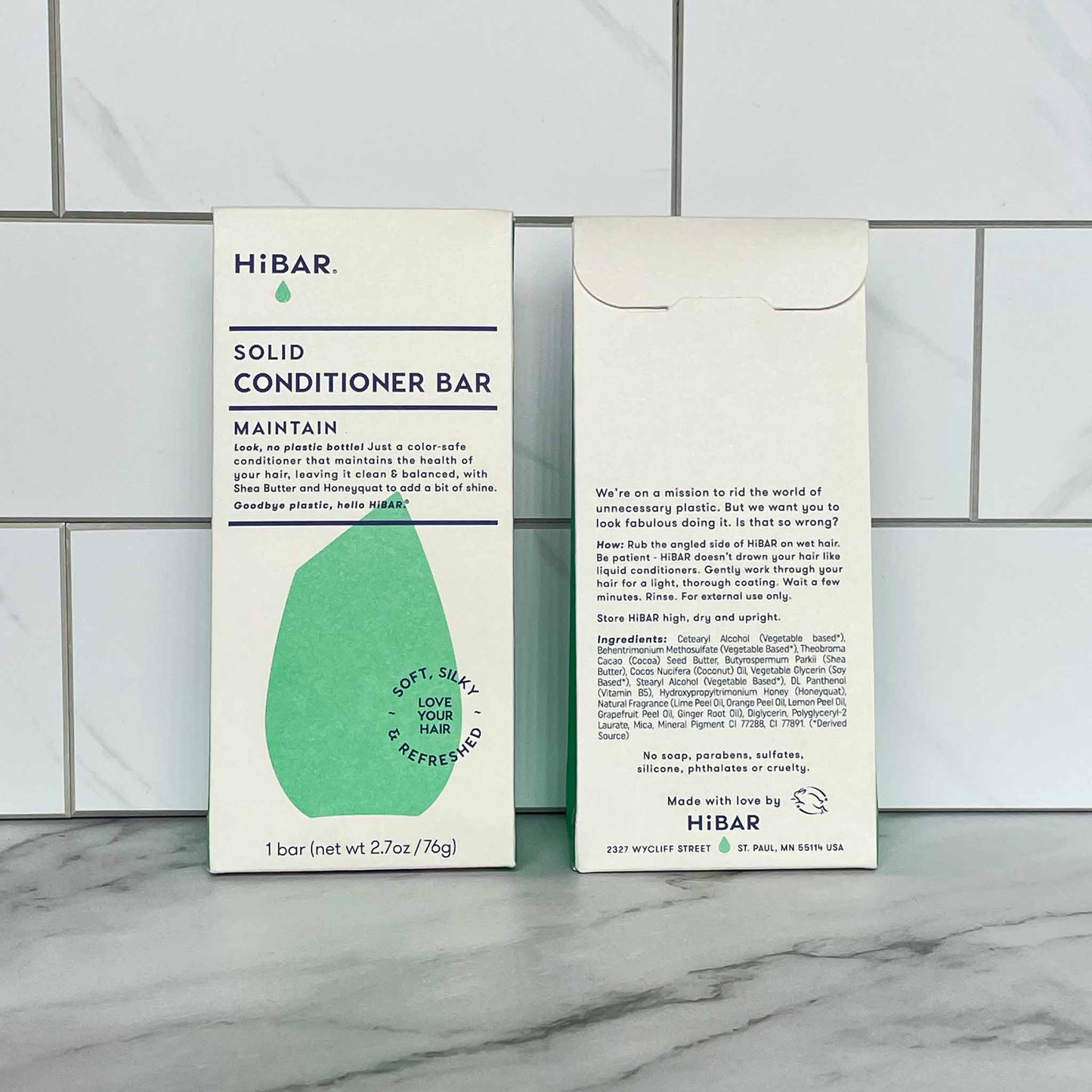 HiBAR Maintain solid conditioner bar packaging on a tiled bathroom floor
