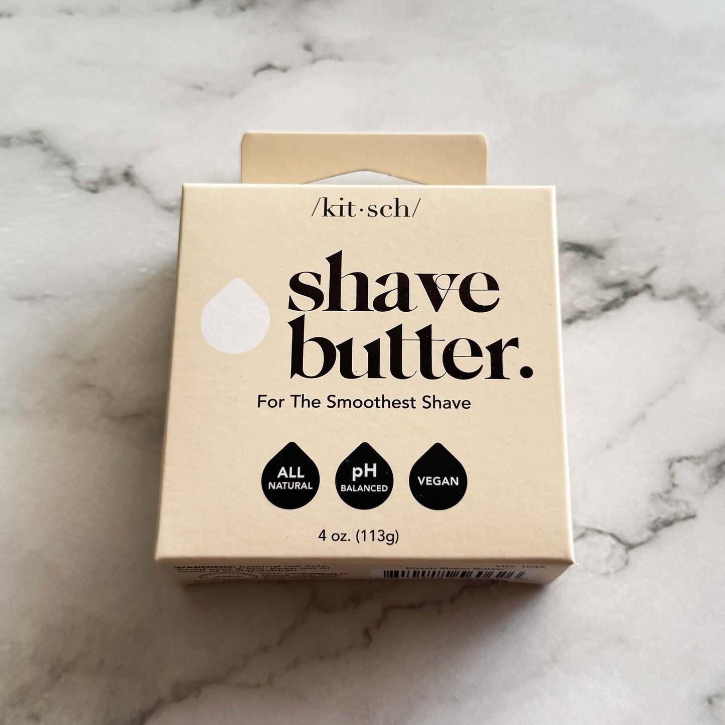 Box of Kitsch shave butter bar on a marble surface