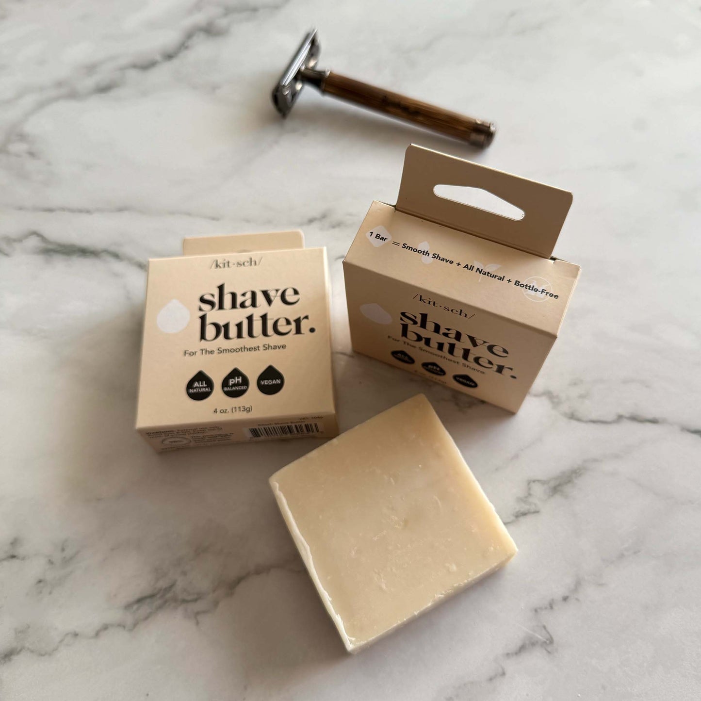 Kitsch Shave butter bar and a razor on a marble surface