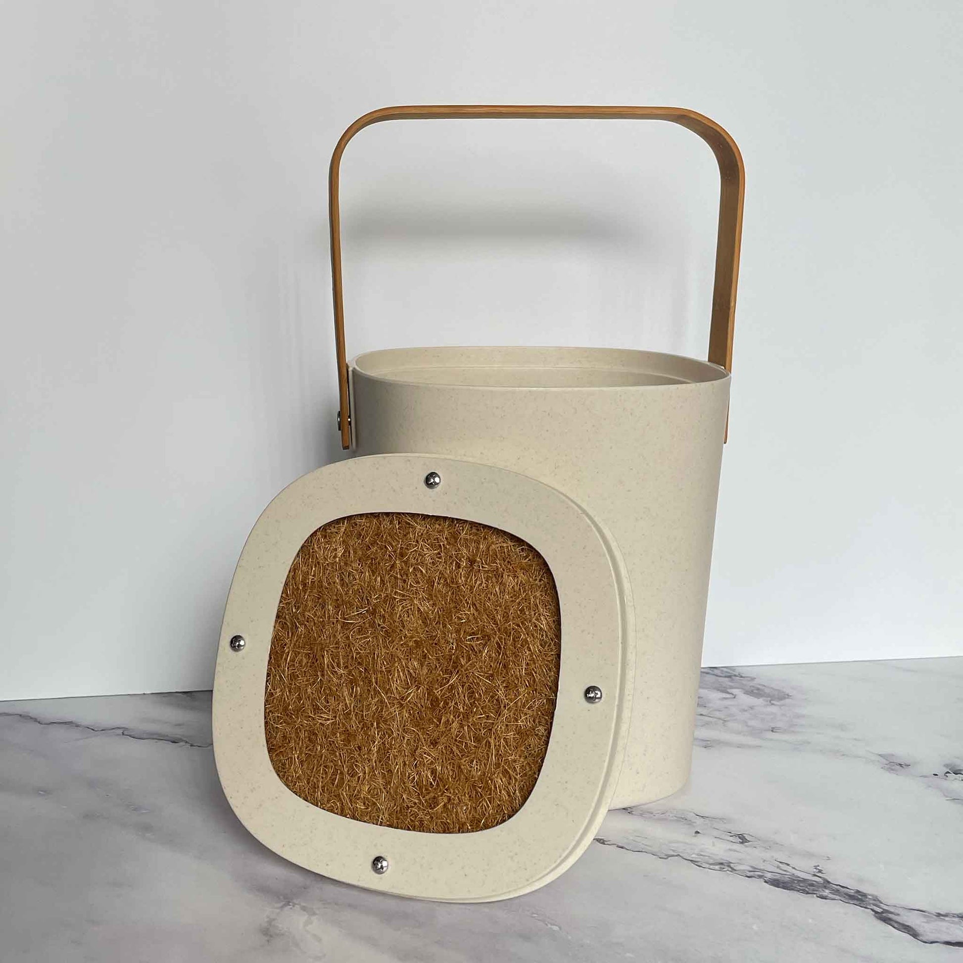 Bamboozle Compost Bins in Natural on a marble countertop