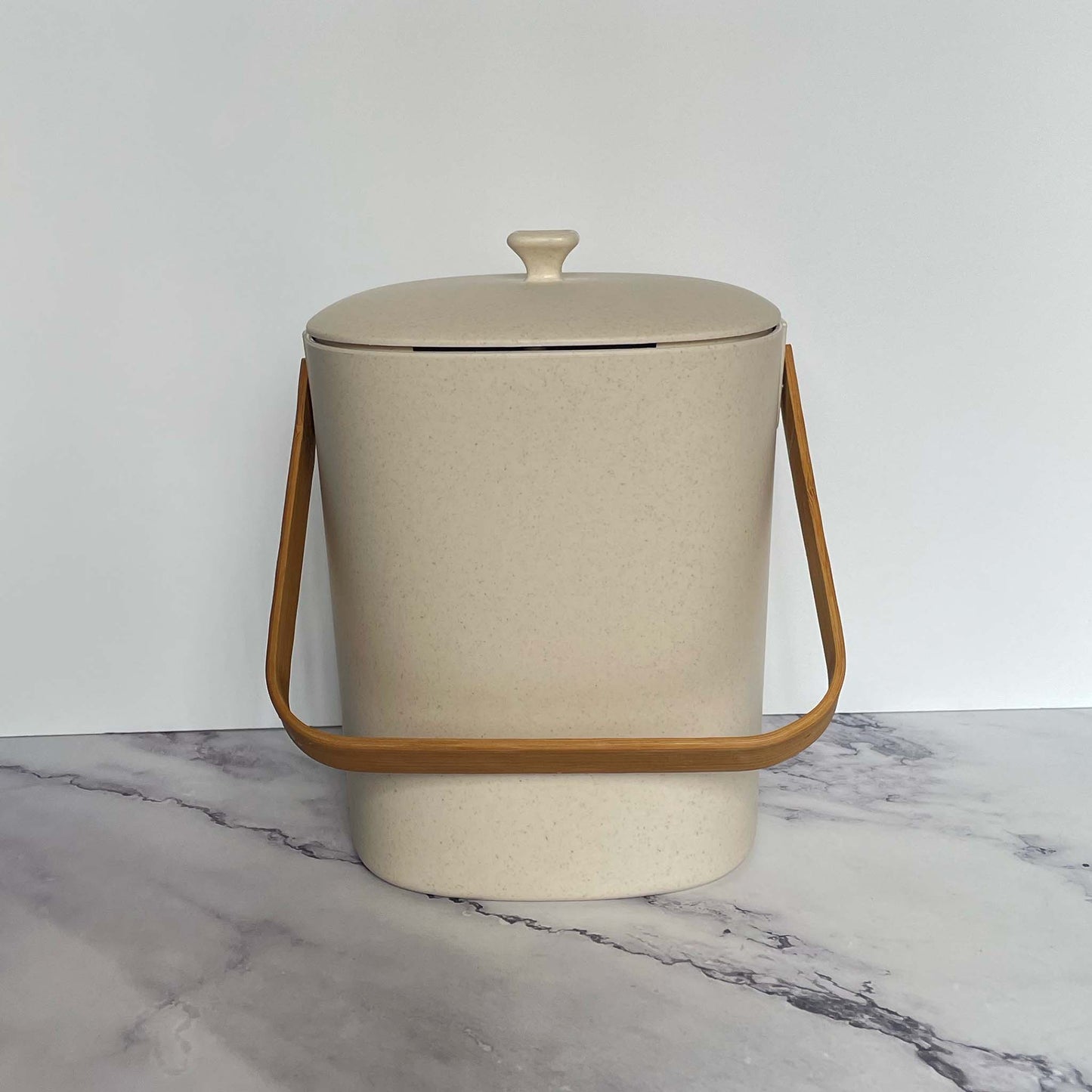  Bamboozle Compost Bins in Natural on a marble countertop