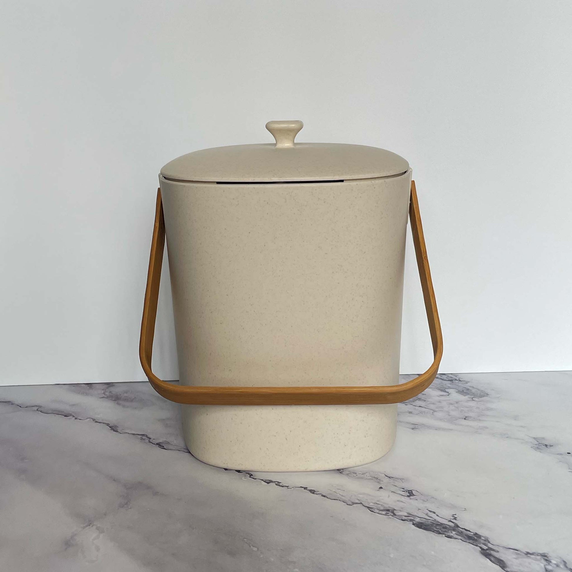  Bamboozle Compost Bins in Natural on a marble countertop