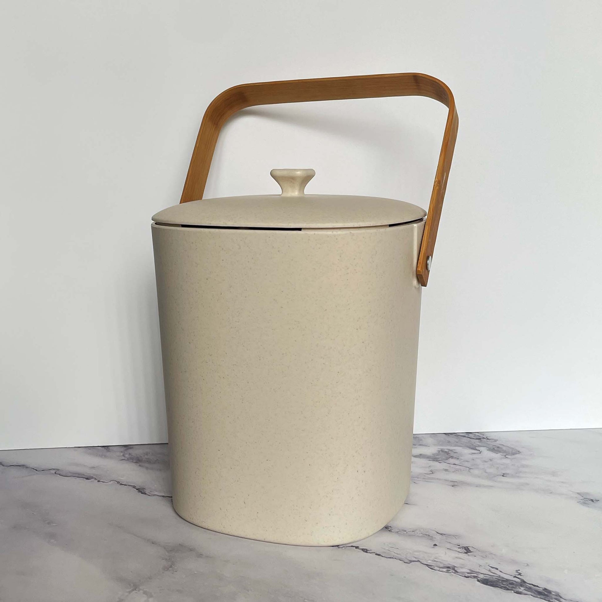 Bamboozle Compost Bins in Natural on a marble countertop