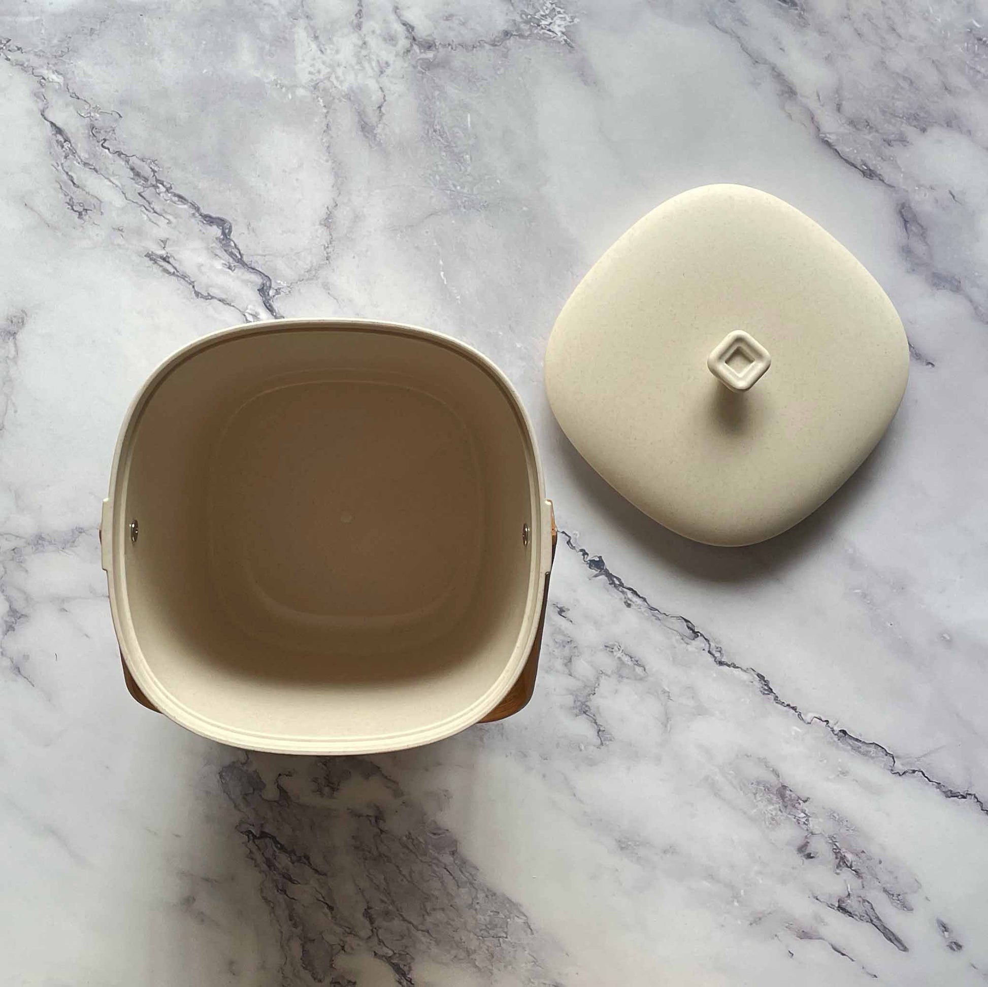 A view from the top of a Bamboozle Compost Bins in Natural on a marble countertop