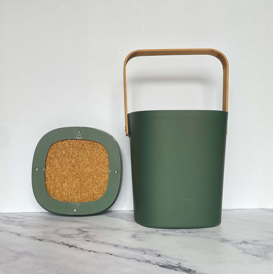 Bamboozle Compost Bins in Forest on a marble countertop against a white background