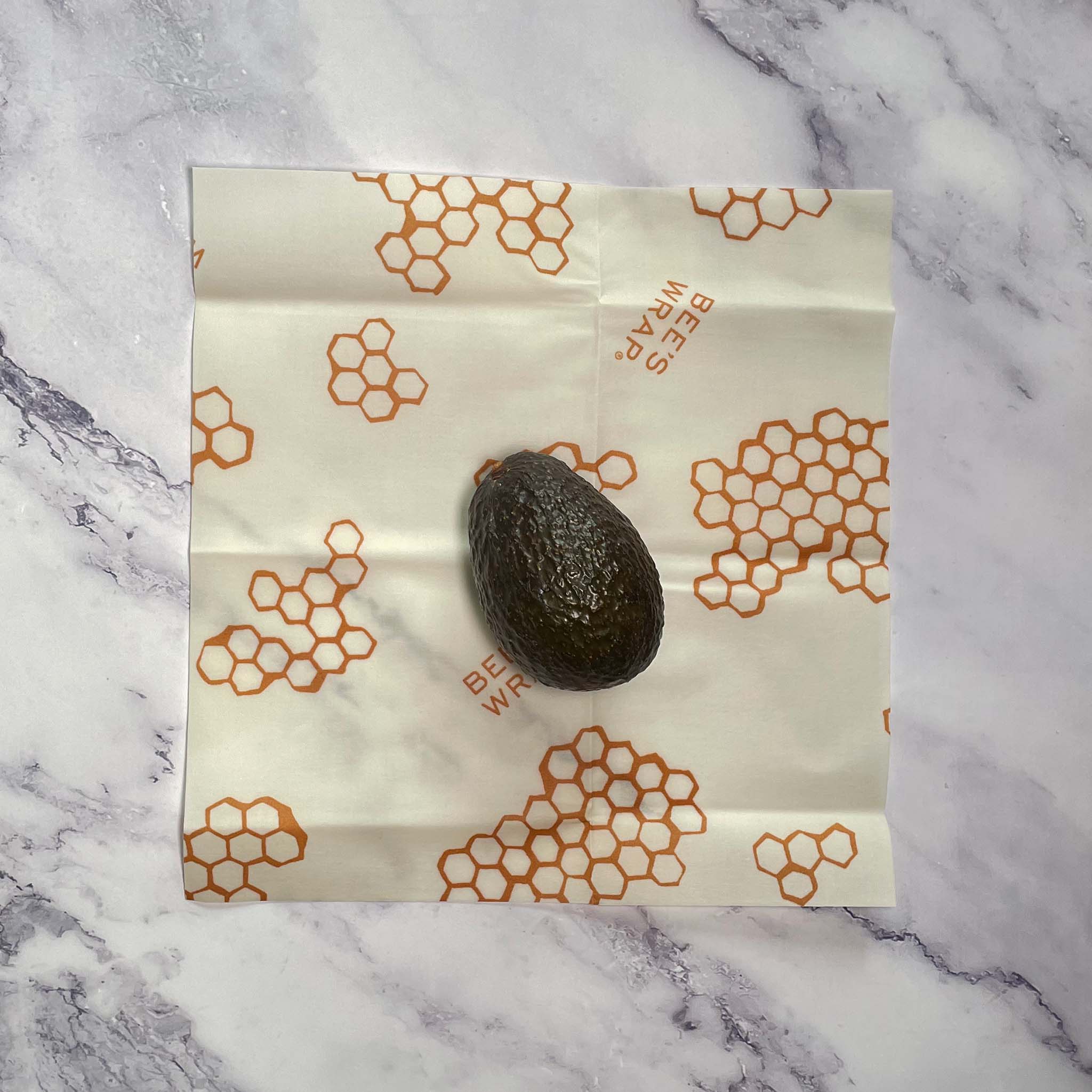 Beeswax Food Wrap, Reusable Food Storage, 3-Pack, Honeycomb Print, Medium with avocado in the middle