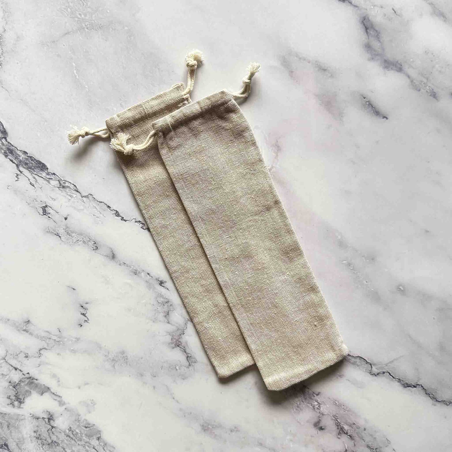 Cotton bags on marble surface