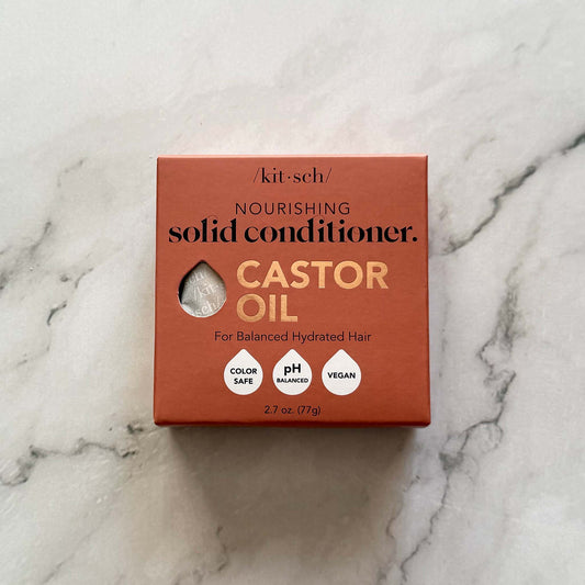 Kitsch castor oil solid conditioner box on a marble background