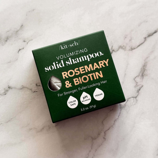 Kitsch volumizing solid shampoo box with rosemary and biotin on a marble background