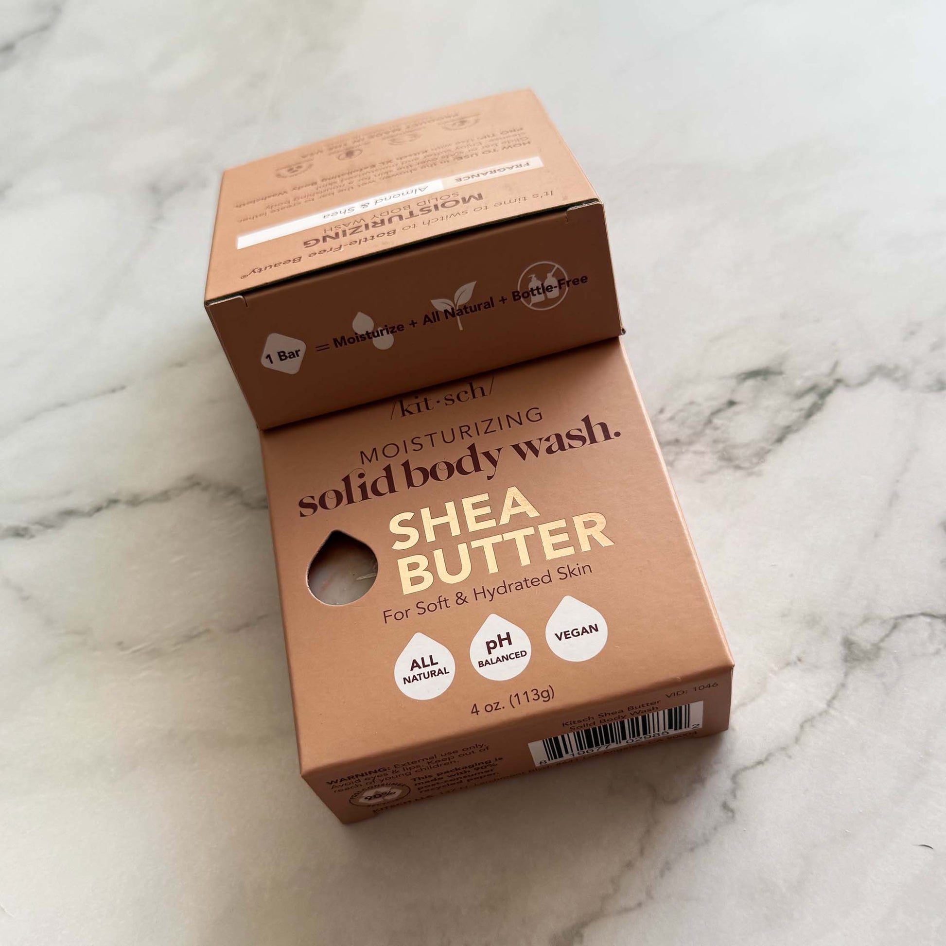 Kitsch Shea butter solid body wash packaging on a marble surface
