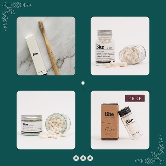 Bundle of Bite brand oral care products including toothpaste tablets, toothbrush, floss, and mouthwash tablets on a teal background.