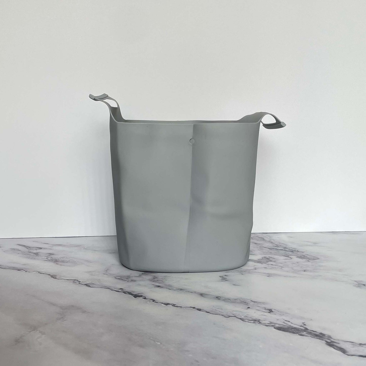 Silicone Compost Bin Liner on a marble surface