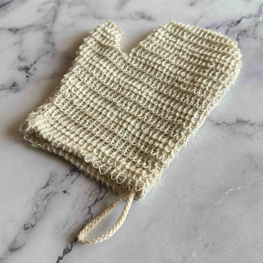 Sisal Exfoliating Shower Glove on marble surface