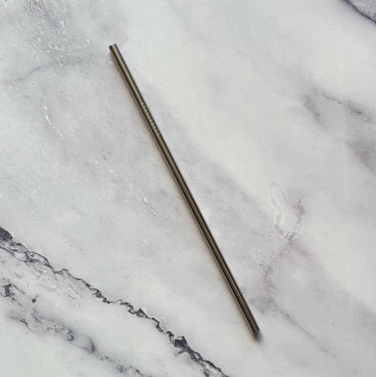 Reusable 8.5 Inch Straight Stainless Steel Straw on marble surface